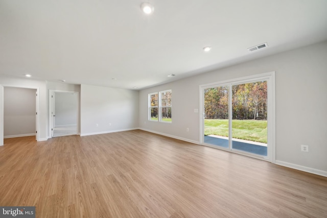 spare room featuring light wood-type flooring