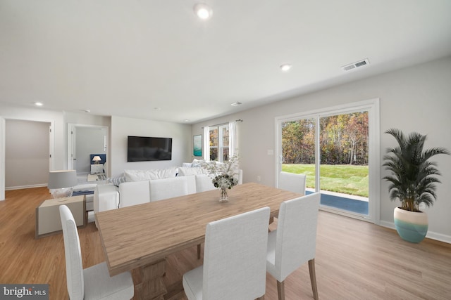 dining space featuring light hardwood / wood-style floors