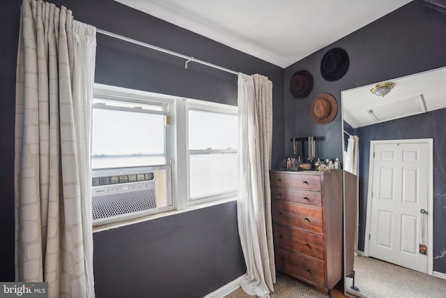 bedroom featuring carpet flooring, lofted ceiling, and cooling unit