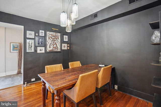 dining room featuring hardwood / wood-style flooring