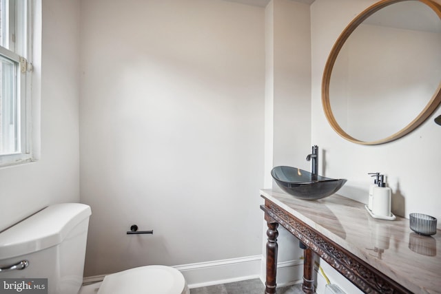 bathroom featuring toilet and sink