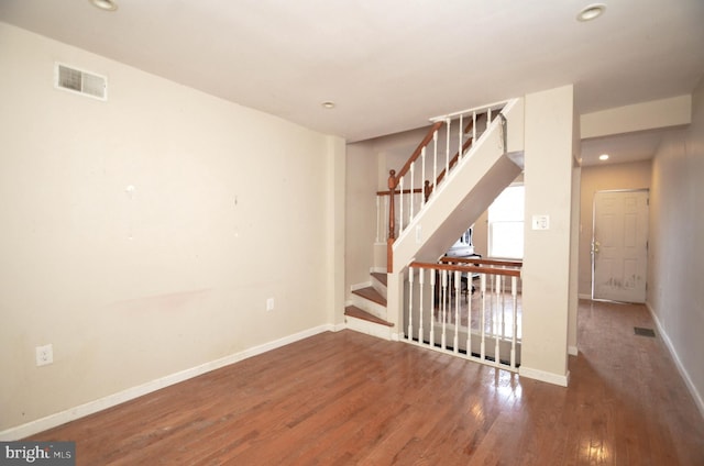 unfurnished room with dark hardwood / wood-style floors