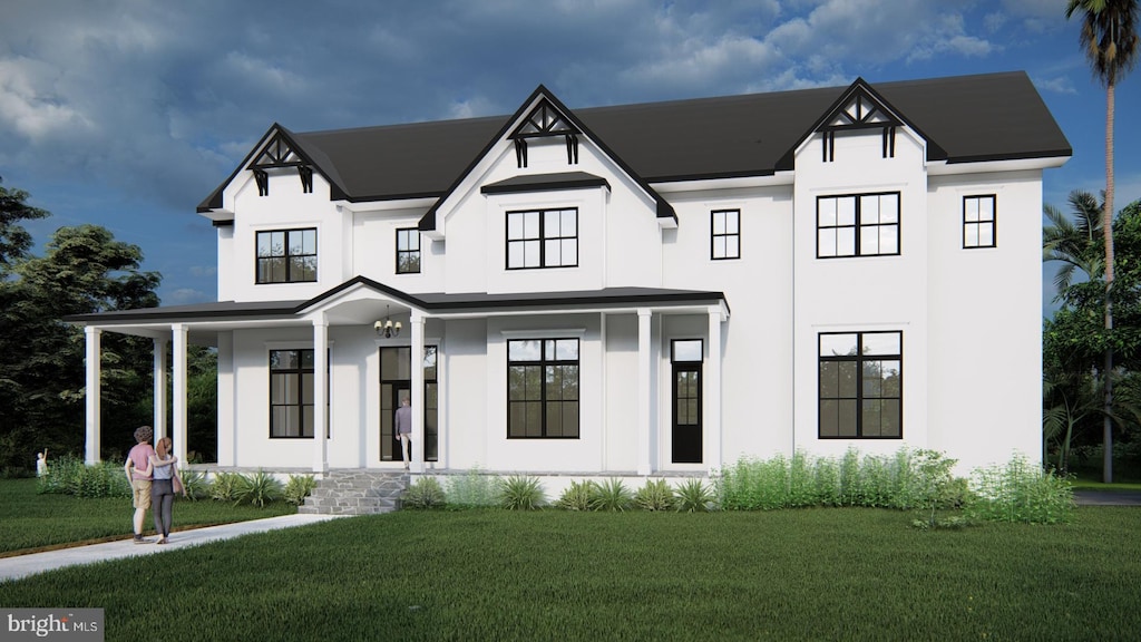 view of front of property featuring a front yard and covered porch