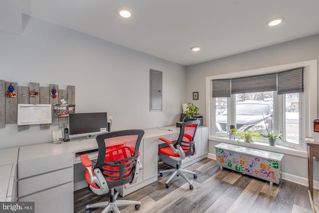 office area featuring wood-type flooring and electric panel