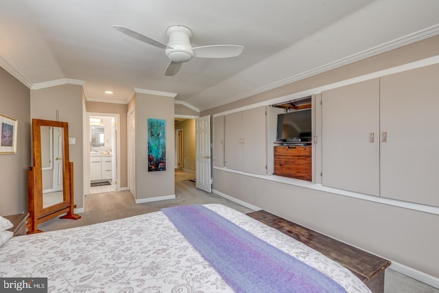 carpeted bedroom featuring a closet, ceiling fan, ornamental molding, and vaulted ceiling