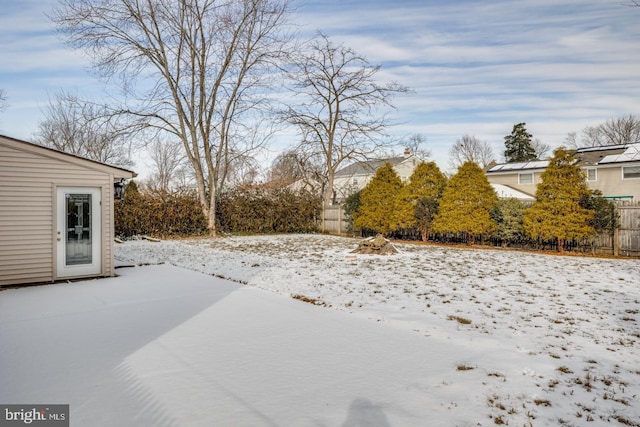 view of yard layered in snow