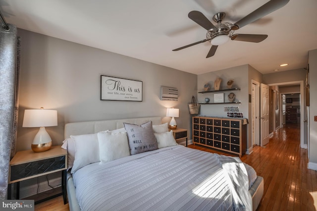 bedroom featuring ceiling fan and wood-type flooring