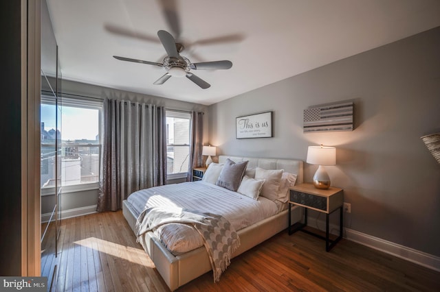 bedroom with ceiling fan and wood-type flooring