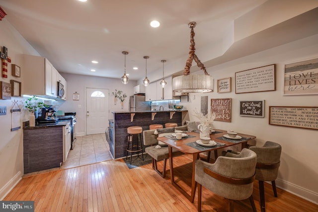 dining space featuring light hardwood / wood-style floors