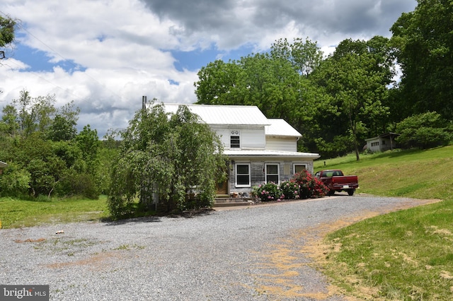 view of front of home with a front yard