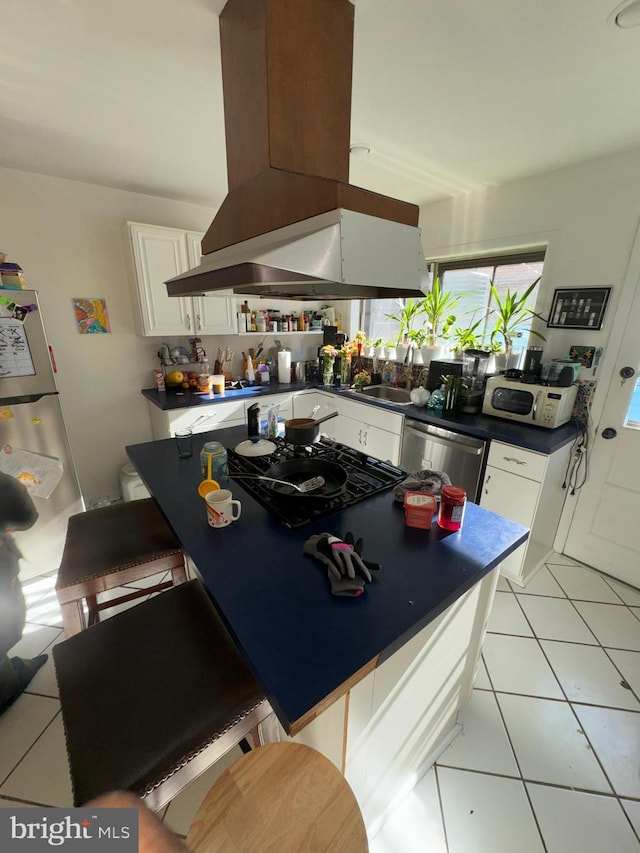 kitchen with white cabinets, dishwasher, black gas stovetop, sink, and island range hood