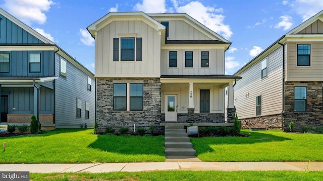 craftsman house with a front yard and a porch