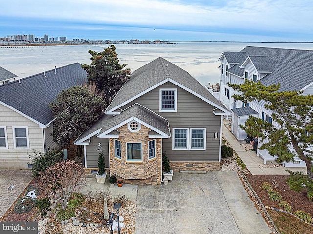 view of front of home with a water view