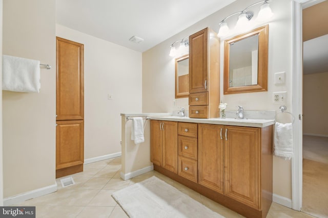 bathroom with vanity and tile patterned floors