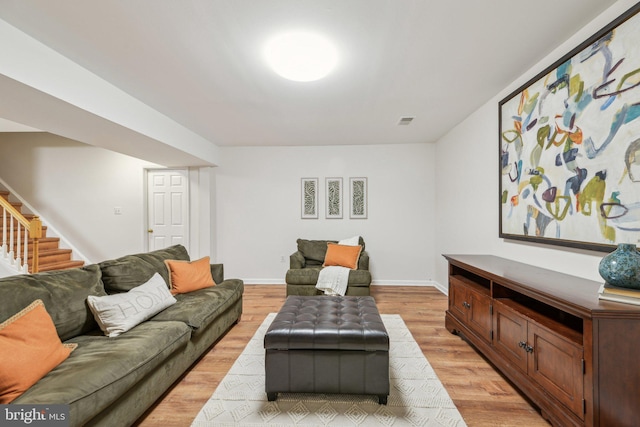 living room with light hardwood / wood-style floors