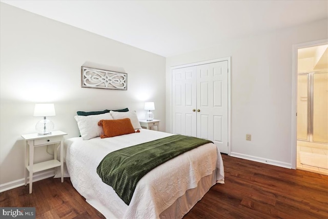 bedroom with dark hardwood / wood-style flooring and a closet