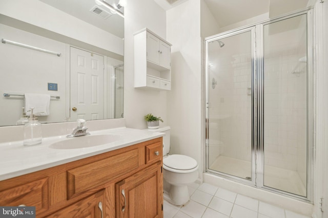 bathroom with walk in shower, tile patterned floors, toilet, and vanity