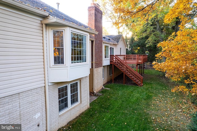 view of yard featuring a wooden deck