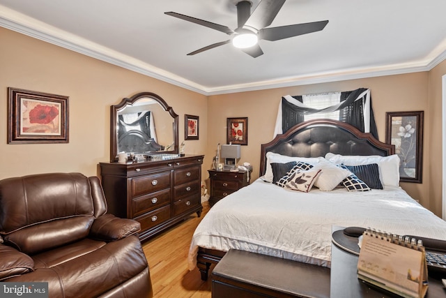 bedroom with crown molding, ceiling fan, and light hardwood / wood-style floors