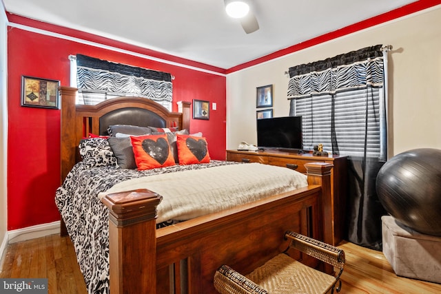 bedroom featuring hardwood / wood-style flooring and ceiling fan