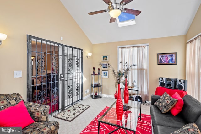 living room with ceiling fan and vaulted ceiling