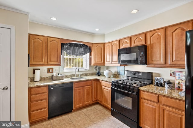 kitchen featuring sink, crown molding, black appliances, light stone countertops, and light tile patterned flooring