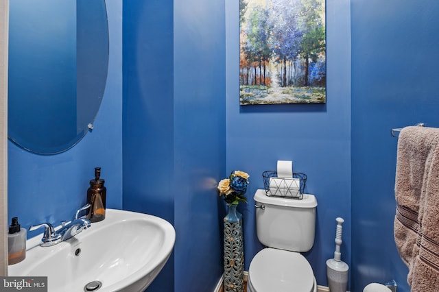 bathroom featuring sink and toilet