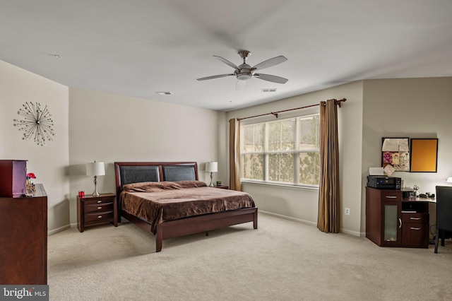 bedroom with light colored carpet and ceiling fan