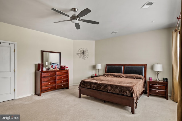 bedroom featuring light colored carpet and ceiling fan