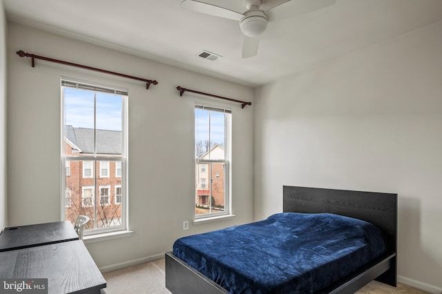 bedroom featuring ceiling fan and light colored carpet