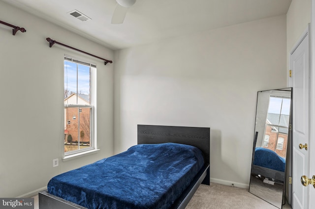 carpeted bedroom featuring ceiling fan