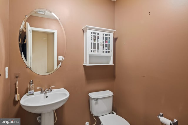 bathroom with sink and toilet