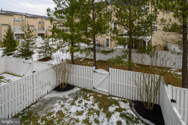 view of yard layered in snow