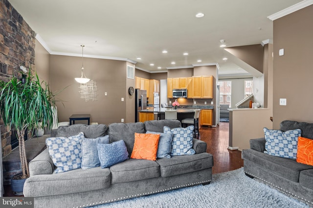 living room featuring dark wood-type flooring and ornamental molding