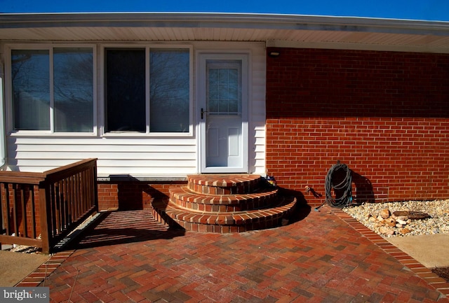 property entrance featuring a patio area