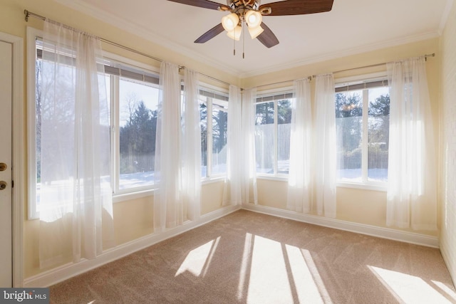 unfurnished sunroom with ceiling fan