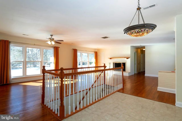 hall with hardwood / wood-style floors