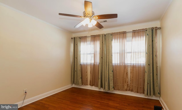 unfurnished room featuring wood-type flooring, ornamental molding, and ceiling fan