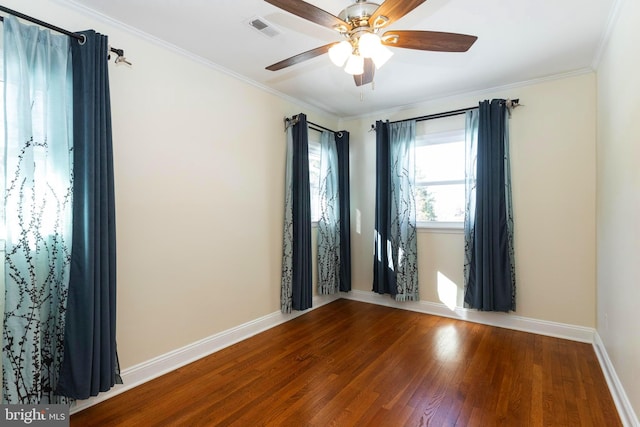 unfurnished room with hardwood / wood-style flooring, crown molding, and ceiling fan