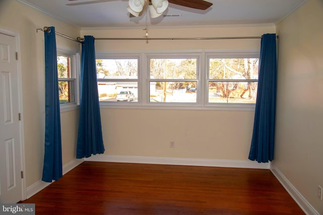 unfurnished room featuring crown molding, dark wood-type flooring, and ceiling fan