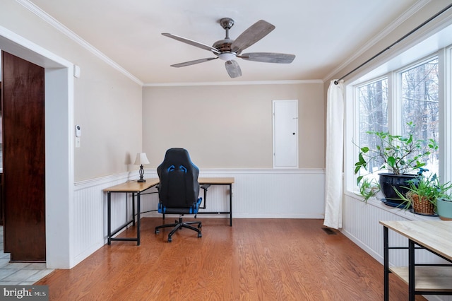 home office with crown molding, hardwood / wood-style flooring, and ceiling fan