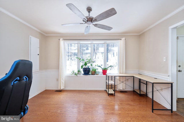 office area with hardwood / wood-style flooring, ceiling fan, and crown molding