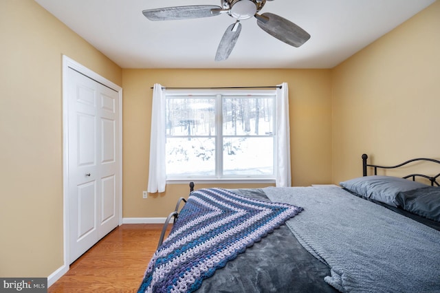 bedroom featuring ceiling fan and light hardwood / wood-style flooring