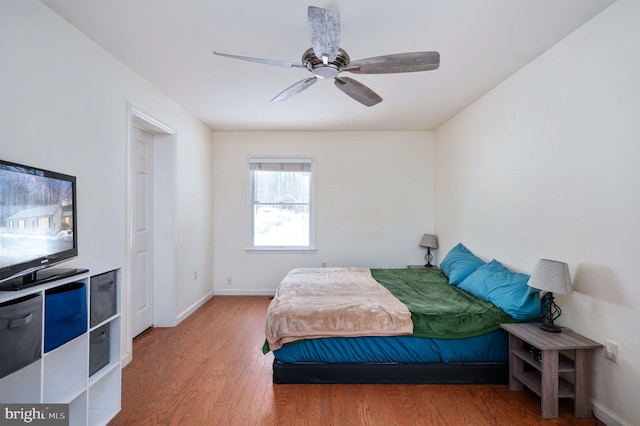 bedroom featuring ceiling fan and hardwood / wood-style floors