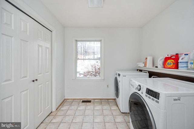 clothes washing area featuring washing machine and dryer