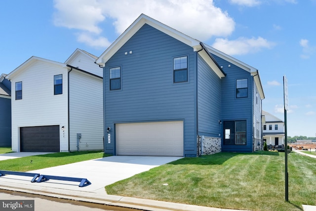 view of front facade with a garage and a front yard