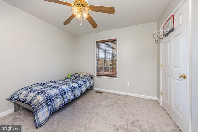 bedroom featuring light carpet and ceiling fan