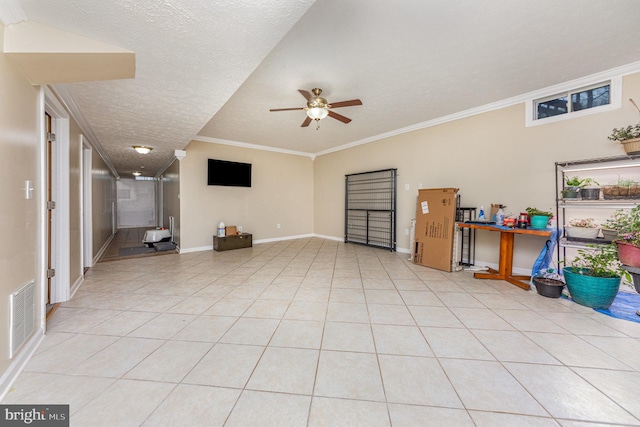 tiled living room with crown molding, ceiling fan, and a textured ceiling