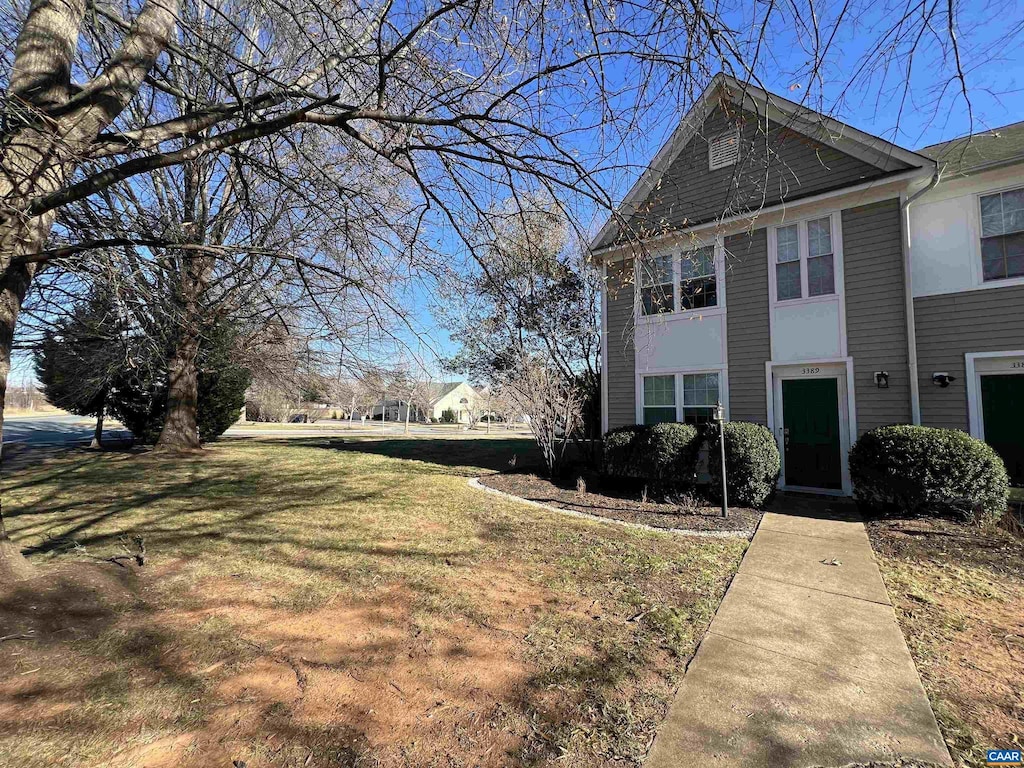 view of side of property featuring a yard