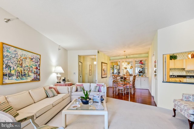 living room featuring an inviting chandelier